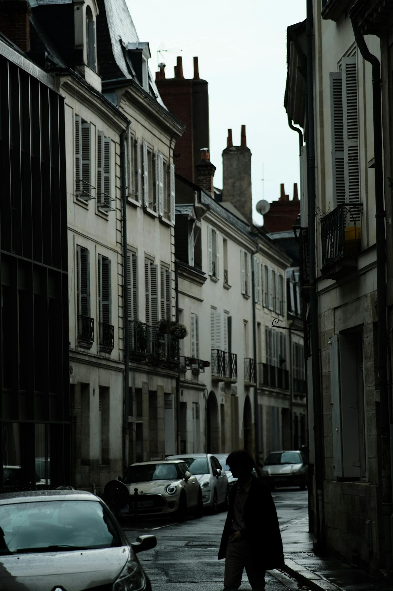 A classic street scene in Tours, France, showcasing historic buildings and city life.
